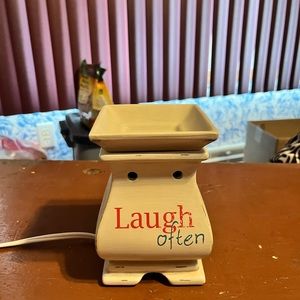 Wax warmer. Off white. With words on all sides.